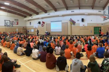 Picture of students in orange shirt day assembly