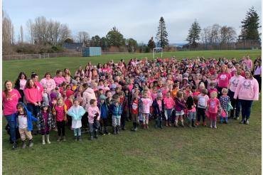 Students and staff at KELSET wearing pink shirts.