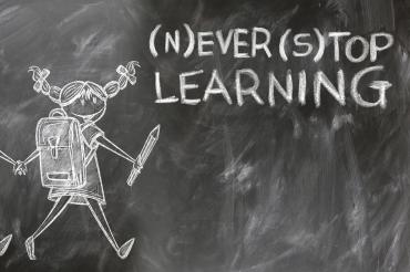 Image of chalk board with Never Stop Learning written.