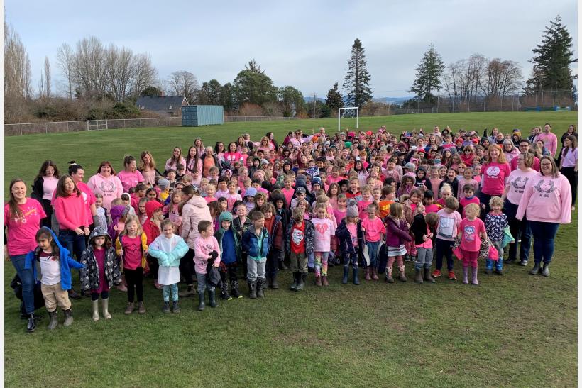 Students and staff at KELSET wearing pink shirts.