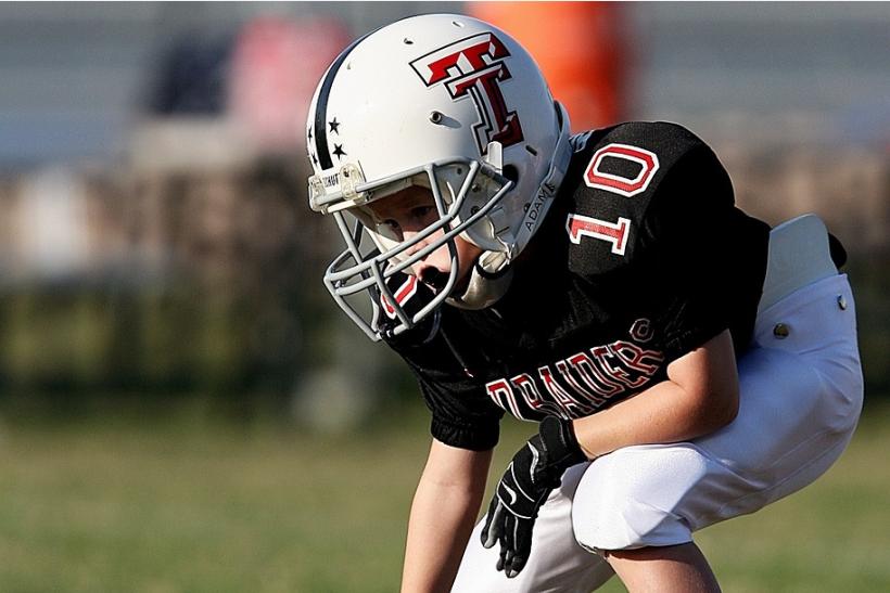 boy wearing football gear